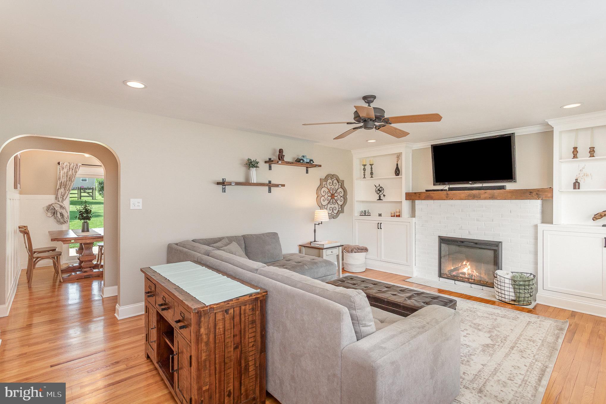1556 Lambeth Road Lancaster, PA 17601 - Photo 7 of 42 a living room with fireplace furniture and a flat screen tv