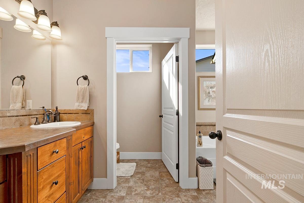 1213 West Lowry Street Meridian, ID 83646 - Photo 26 of 38 Bathroom with vanity and toilet
