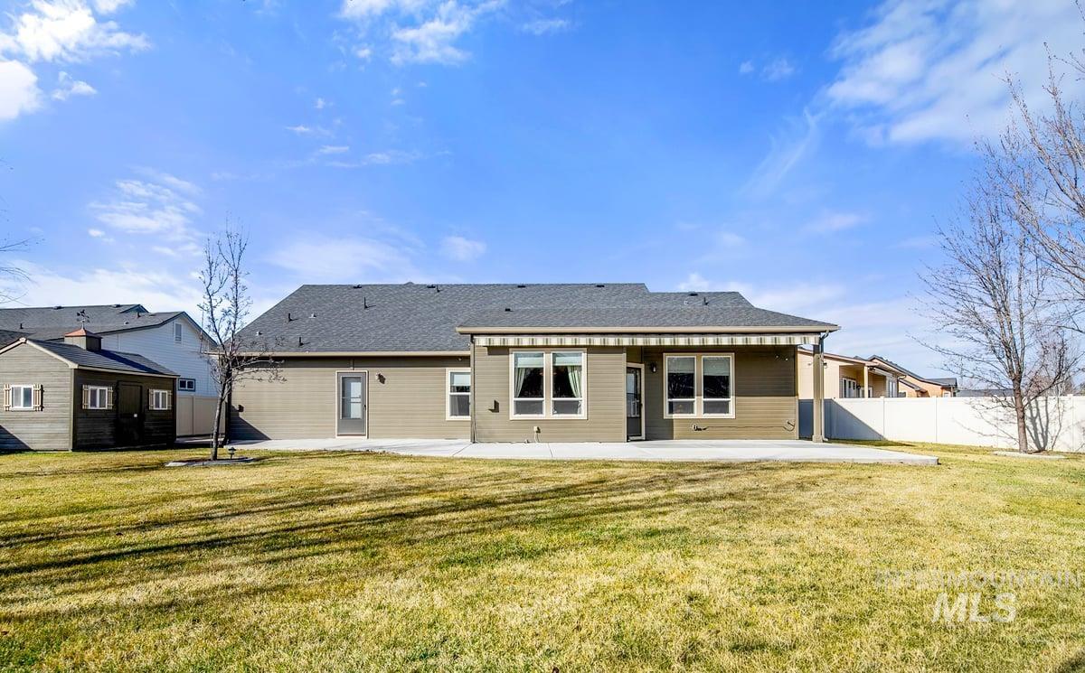 1213 West Lowry Street Meridian, ID 83646 - Photo 32 of 38 Rear view of property with a patio