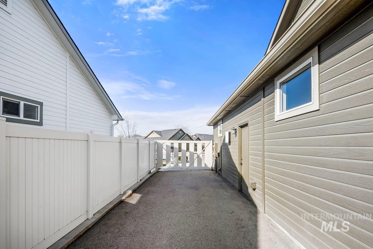 1213 West Lowry Street Meridian, ID 83646 - Photo 36 of 38 View of side of home featuring a gate