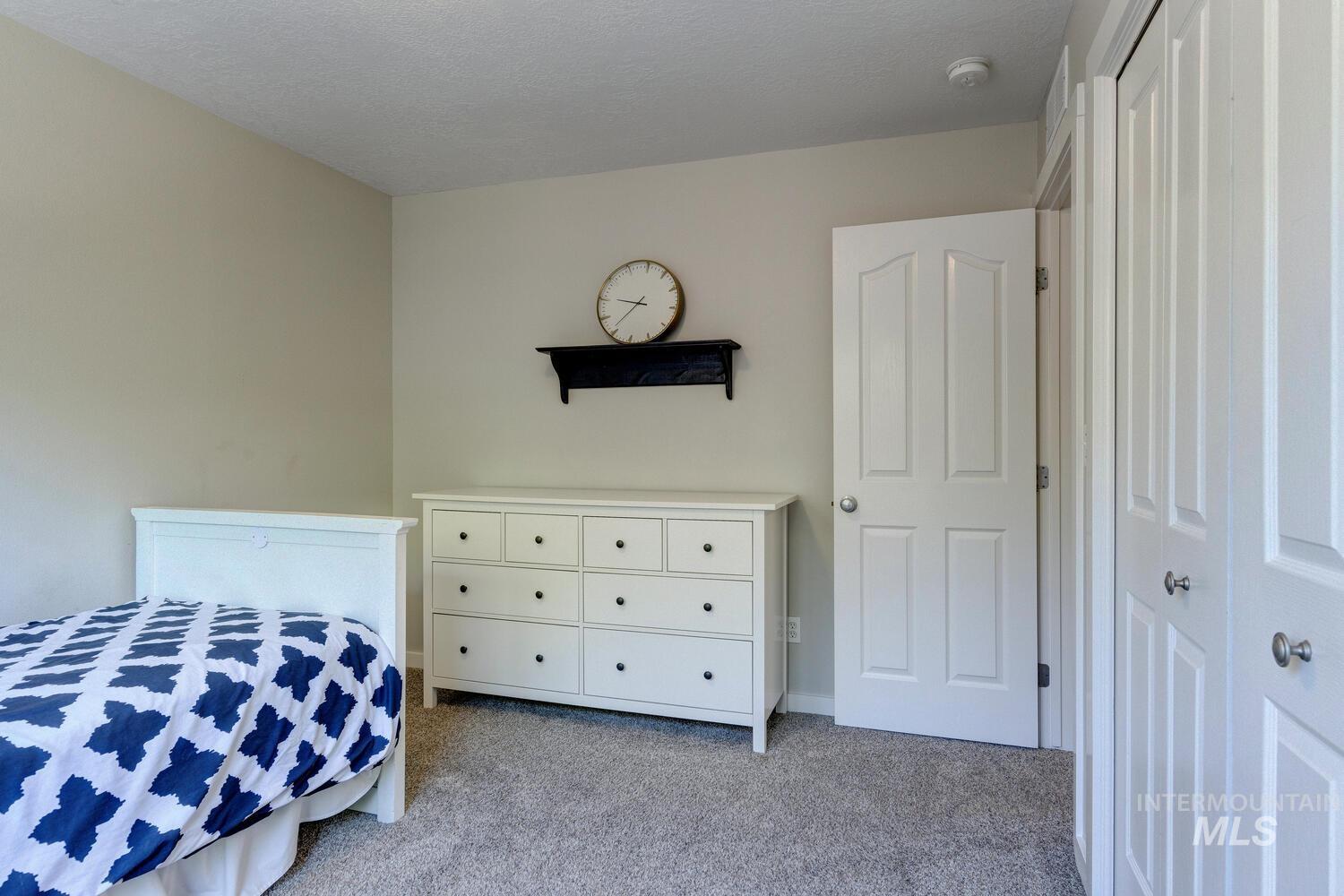 5572 West School Ridge Road Boise, ID 83714 - Photo 26 of 50 View of carpeted bedroom