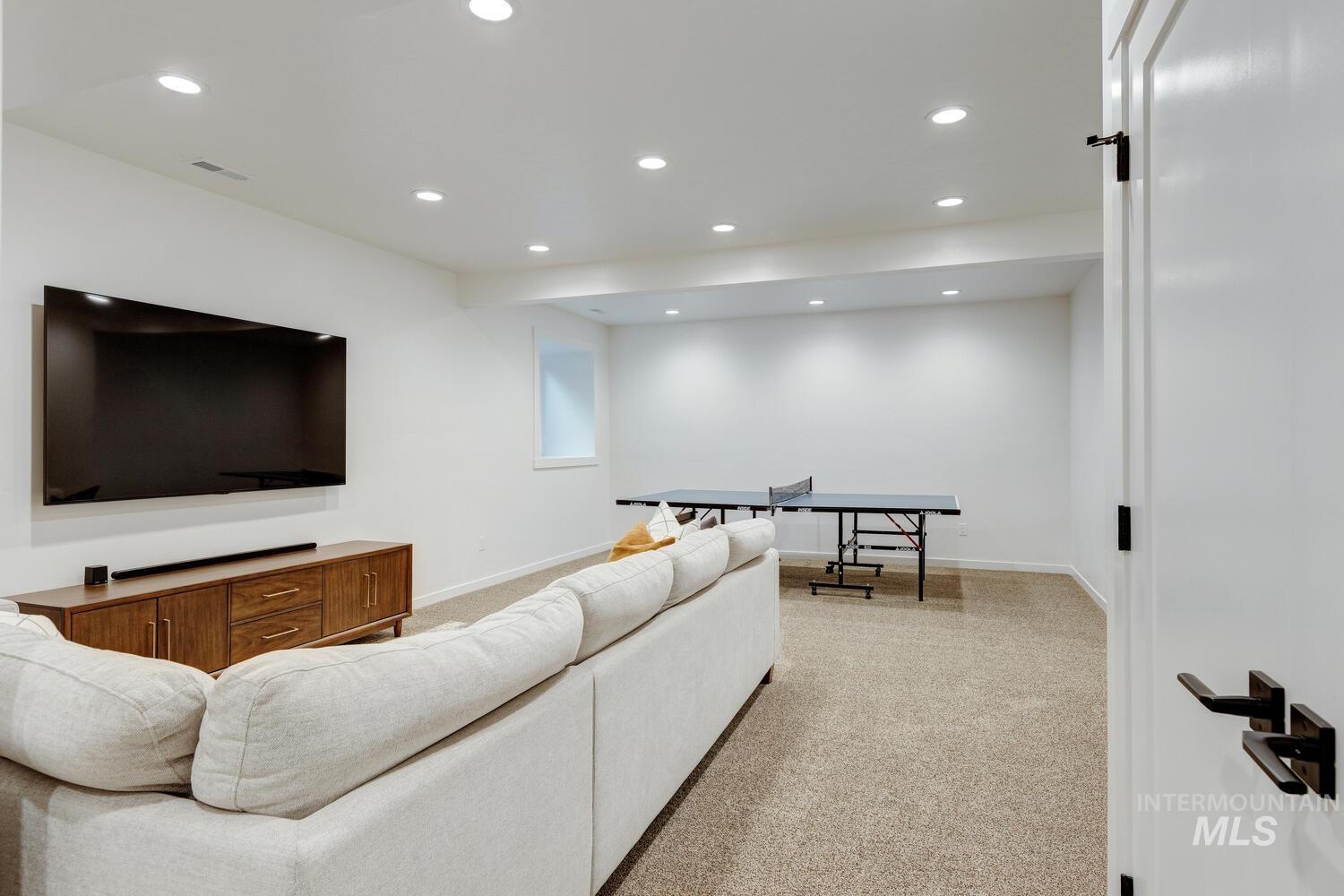 5572 West School Ridge Road Boise, ID 83714 - Photo 28 of 50 Living area featuring light colored carpet and recessed lighting