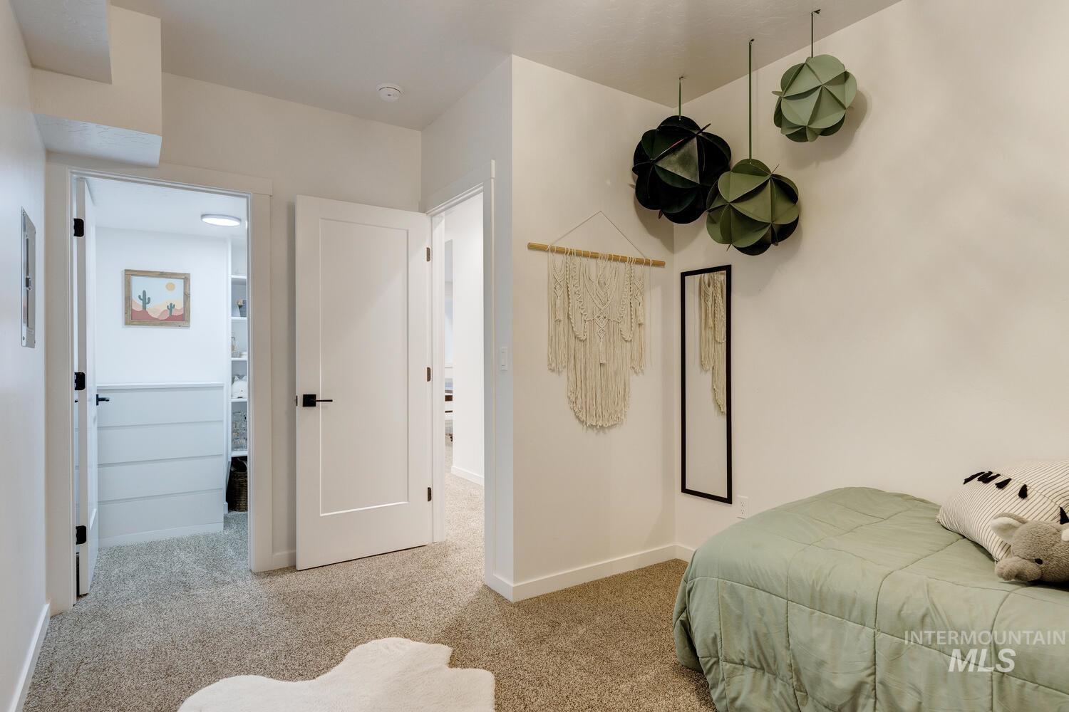 5572 West School Ridge Road Boise, ID 83714 - Photo 33 of 50 Bedroom with carpet and baseboards