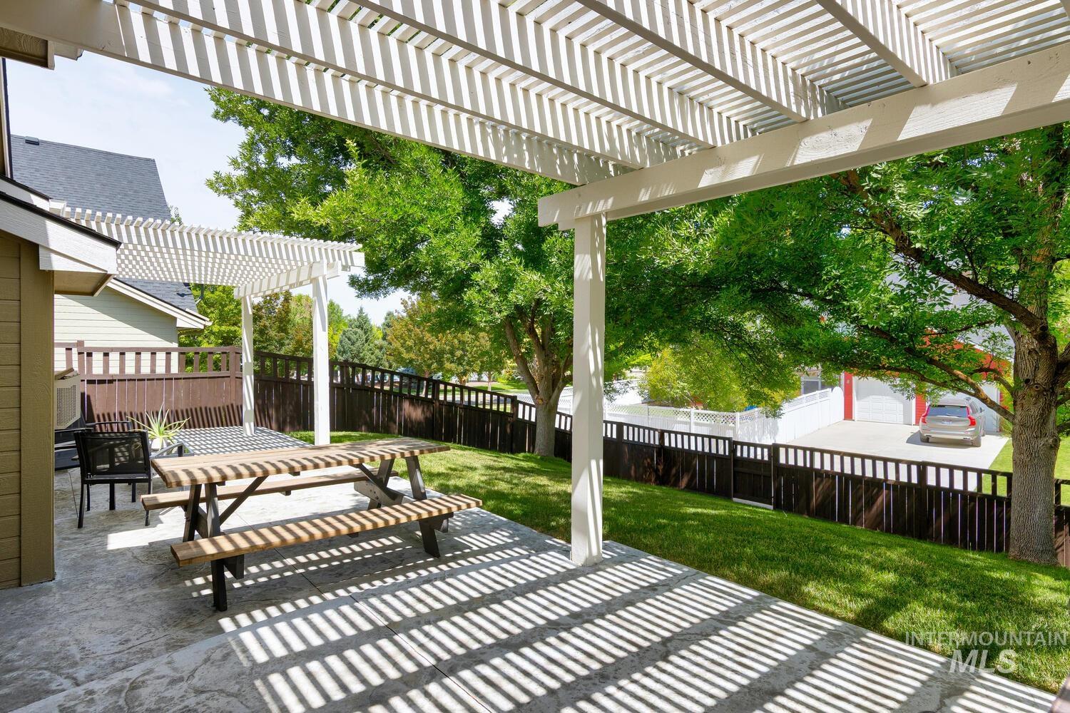 5572 West School Ridge Road Boise, ID 83714 - Photo 39 of 50 Fenced backyard featuring a pergola and a patio