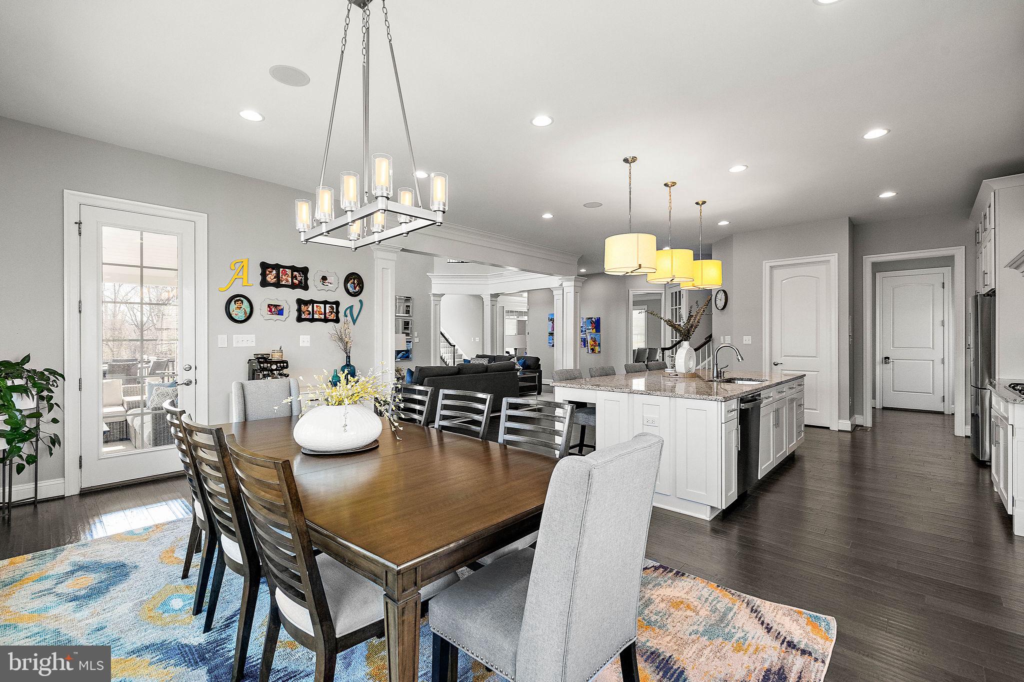 713 Stonecliffe Road Malvern, PA 19355 - Photo 17 of 56 a kitchen with a dining table chairs and view living room