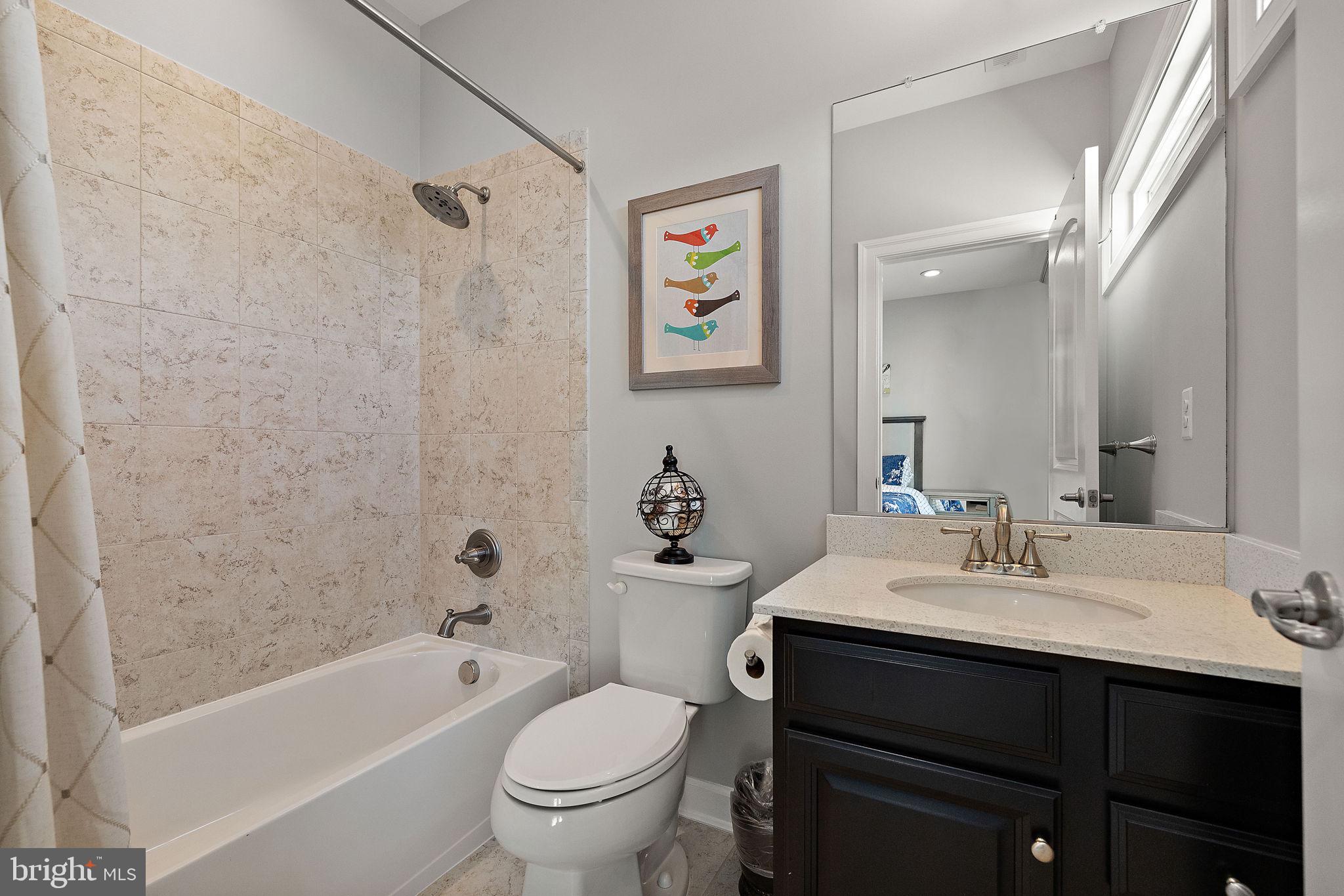 713 Stonecliffe Road Malvern, PA 19355 - Photo 30 of 56 a bathroom with a sink a toilet and a bathtub