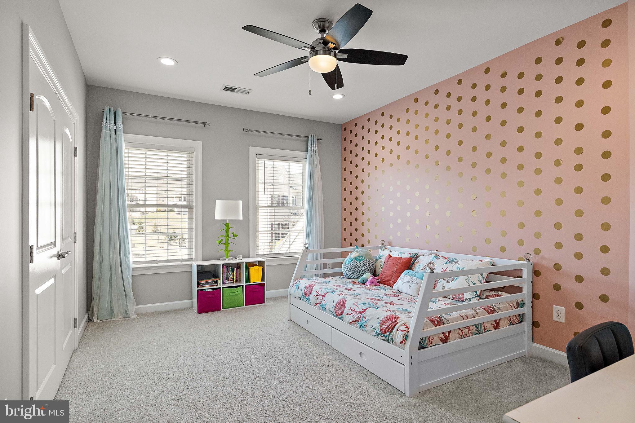 713 Stonecliffe Road Malvern, PA 19355 - Photo 33 of 56 a spacious bedroom with a bed and a chandelier