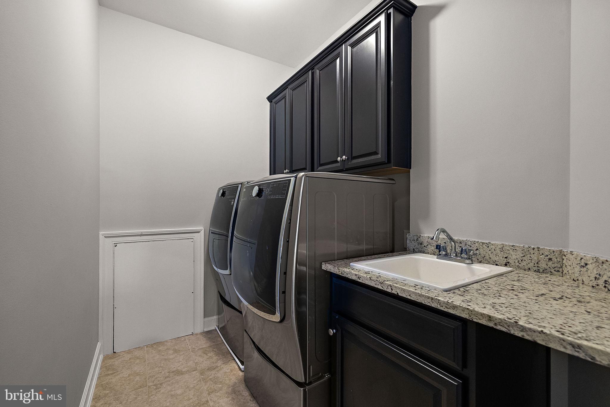 713 Stonecliffe Road Malvern, PA 19355 - Photo 35 of 56 a bathroom with a granite countertop sink and a mirror