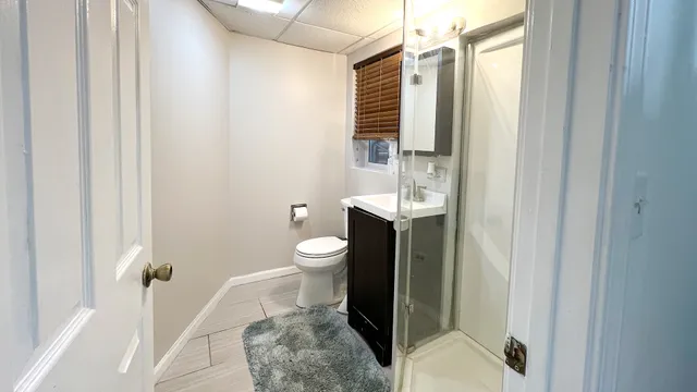 a bathroom with a toilet a sink and tub