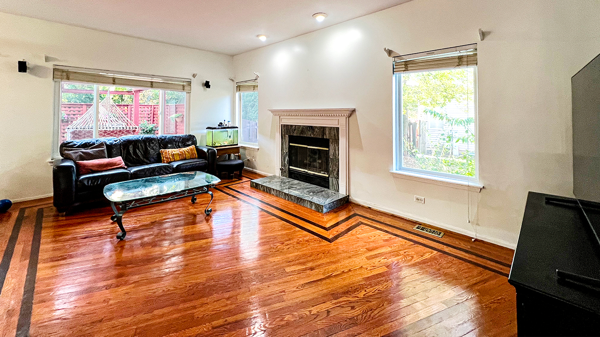 968 Knowles Road Gurnee, IL 60031 - Photo 9 of 33 a living room with furniture a flat screen tv and a fireplace