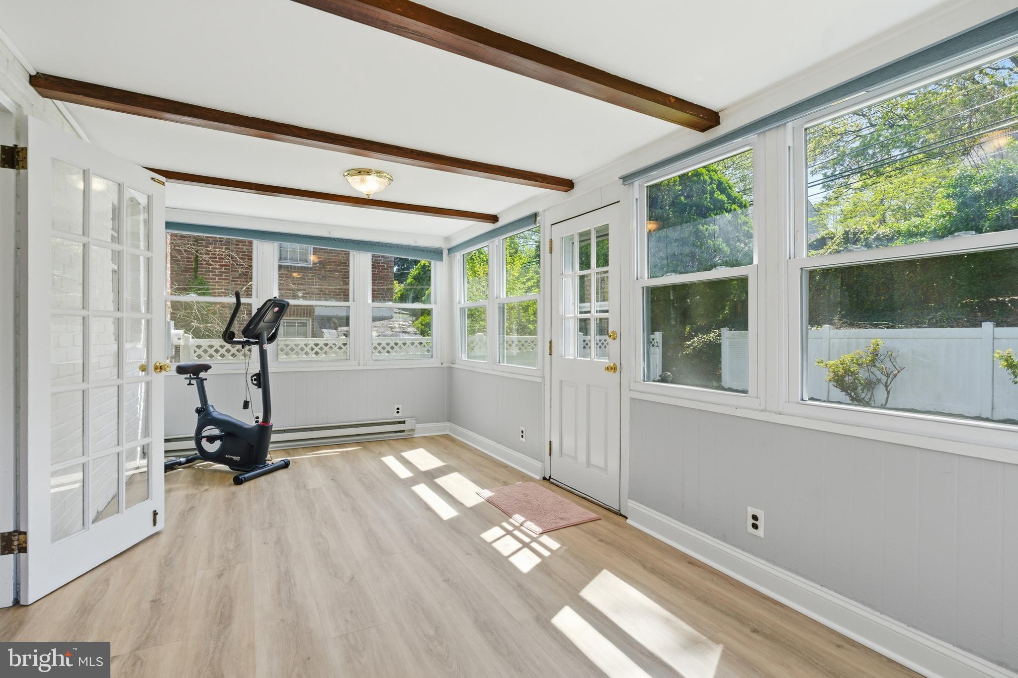 308 Canterbury Road Havertown, PA 19083 - Photo 15 of 26 a view of a room with gym equipment and floor to ceiling windows