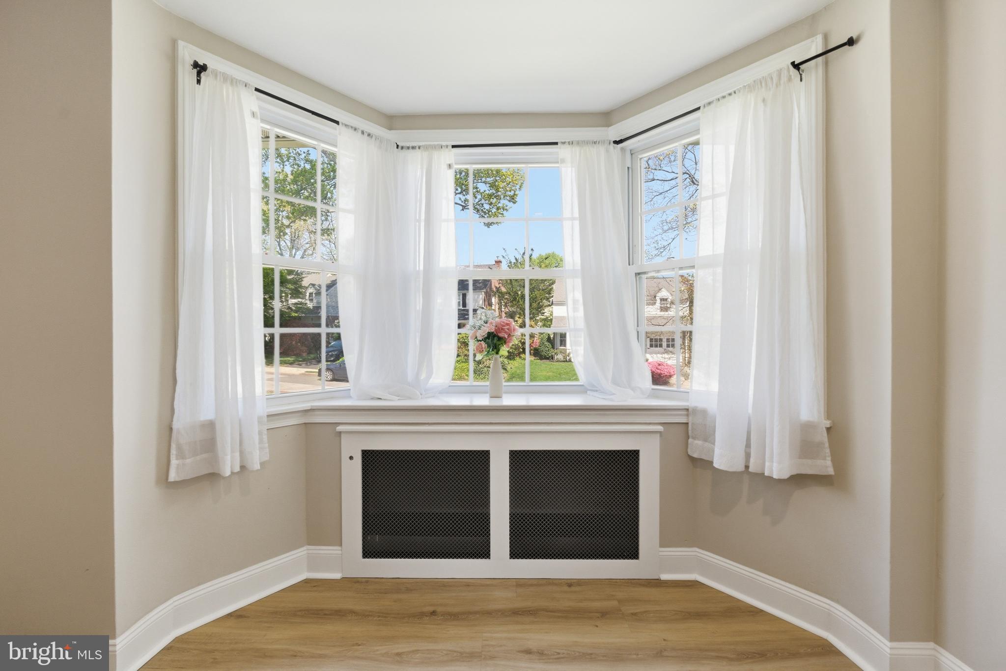 308 Canterbury Road Havertown, PA 19083 - Photo 5 of 26 a view of a livingroom with a fireplace and wooden floor