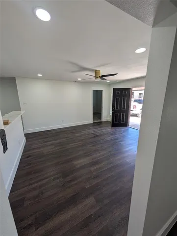 a view of a livingroom with wooden floor