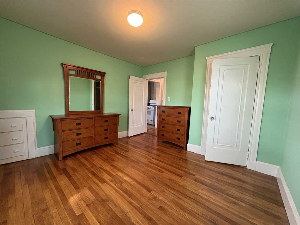 155-157 Hillside Street, Unit 2 Boston, MA 02120 - Photo 12 of 15 a living room with furniture and a dresser