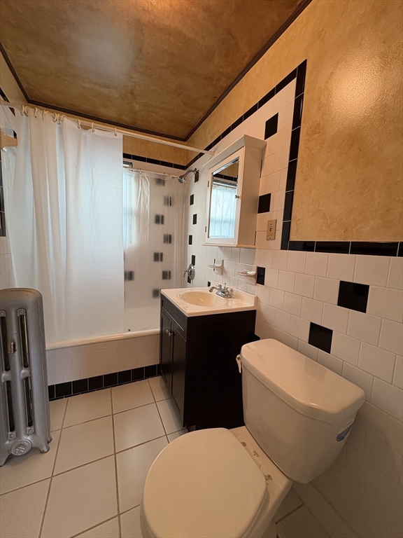 155-157 Hillside Street, Unit 2 Boston, MA 02120 - Photo 14 of 15 a bathroom with a sink a toilet and shower