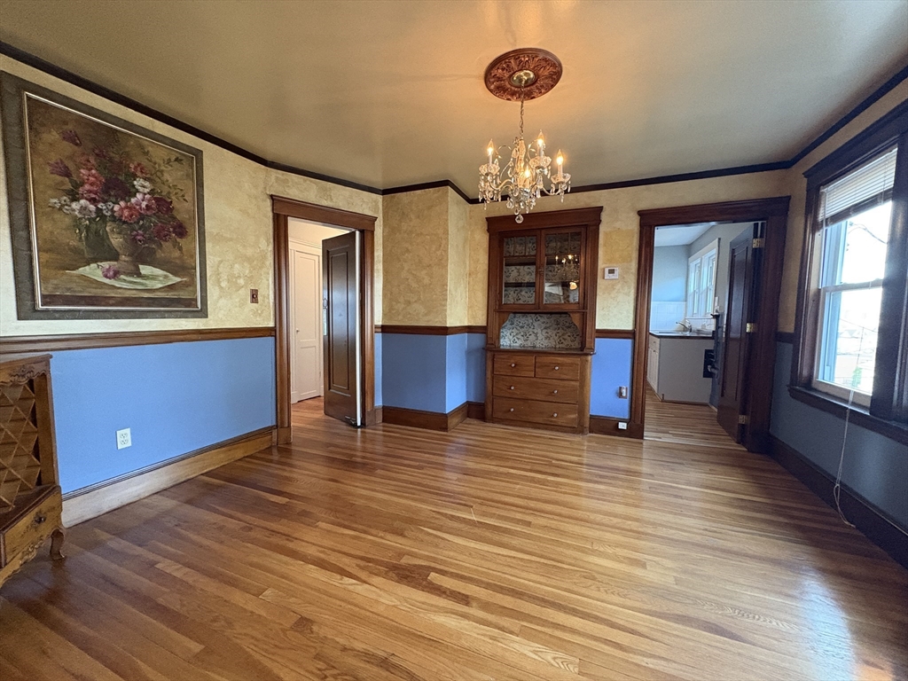 155-157 Hillside Street, Unit 2 Boston, MA 02120 - Photo 3 of 15 wooden floor in an empty room with a window