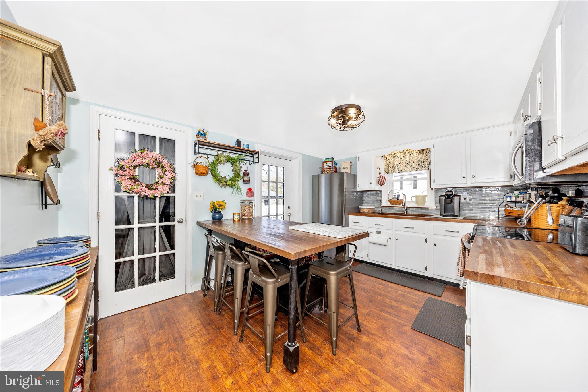 5618 Bartonsville Road Frederick, MD 21704 - Photo 8 of 53 a view of a kitchen with furniture and a window