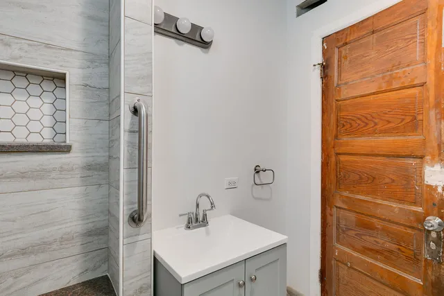 a bathroom with a sink and a mirror
