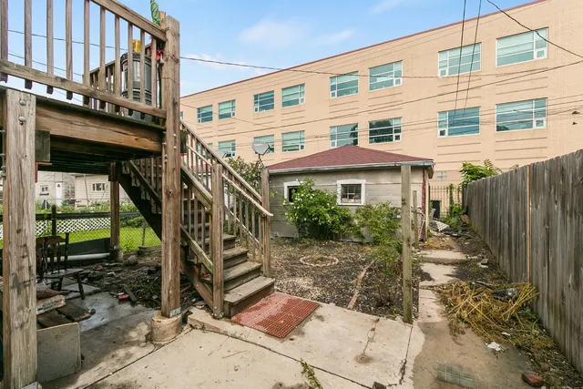 a front view of a house with stairs yard