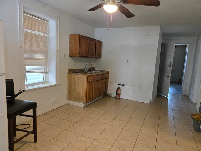 a view of room with window and furniture