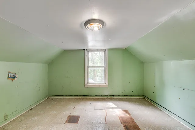 an empty room with windows and entrance