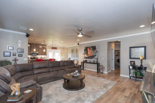 a room with a table chairs and wooden floor
