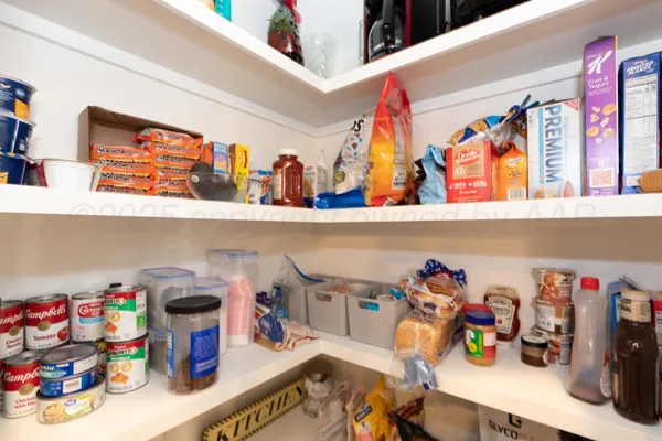 a bath room with a granite countertop sink and a mirror