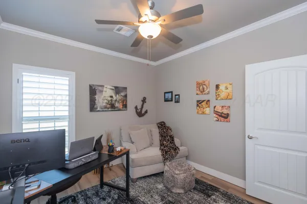 a view of a livingroom with furniture and a flat screen tv