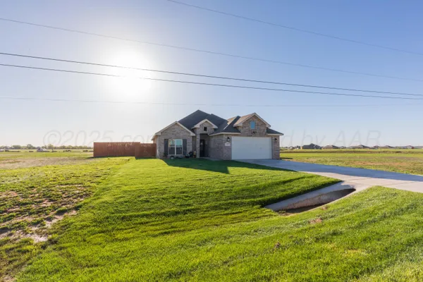 a view of a house with a big yard