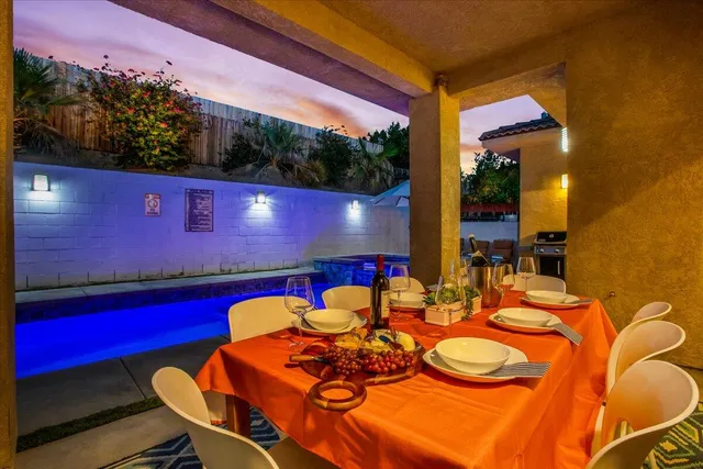 a kitchen with stainless steel appliances kitchen island granite countertop a refrigerator and a stove top oven