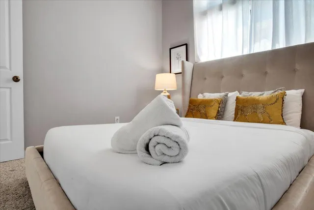 a kitchen with stainless steel appliances kitchen island granite countertop a refrigerator and a stove