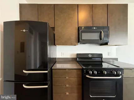 a kitchen with a stove and a microwave