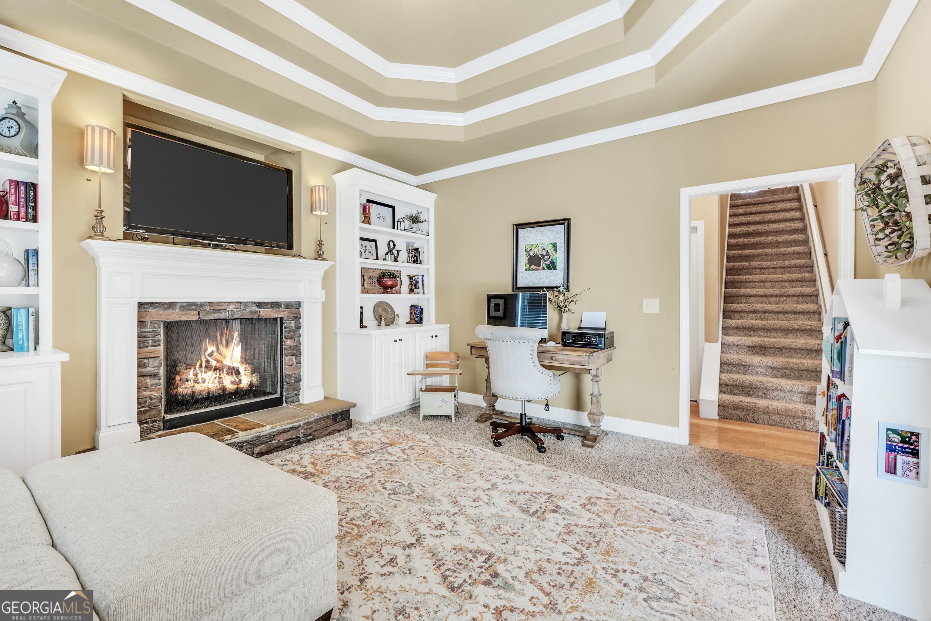 196 Magnolia Trace Milner, GA 30257 - Photo 26 of 48 a living room with furniture a fireplace and a flat screen tv
