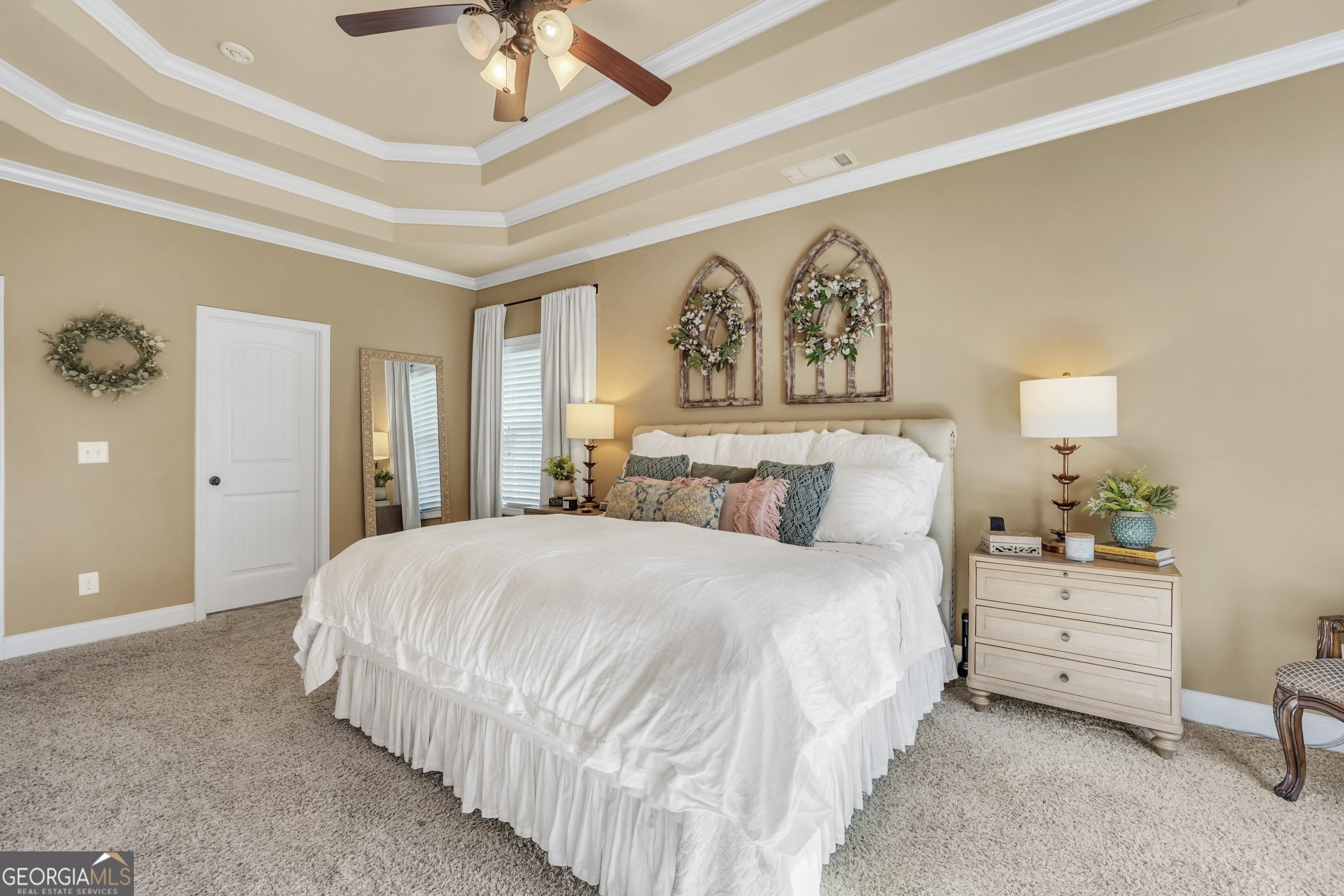 196 Magnolia Trace Milner, GA 30257 - Photo 29 of 48 a bedroom with a bed and a chandelier