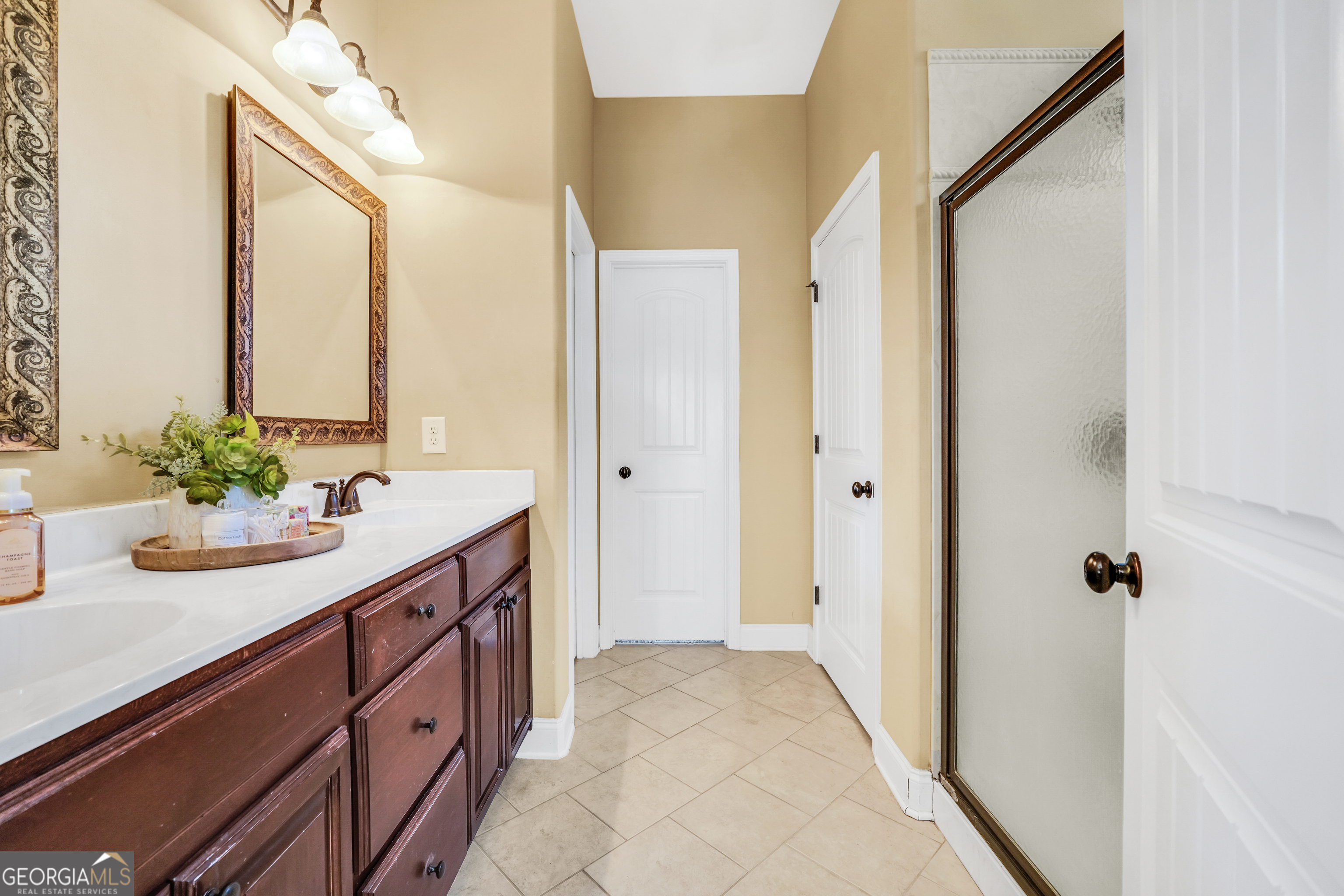 196 Magnolia Trace Milner, GA 30257 - Photo 31 of 48 a bathroom with a sink and a mirror