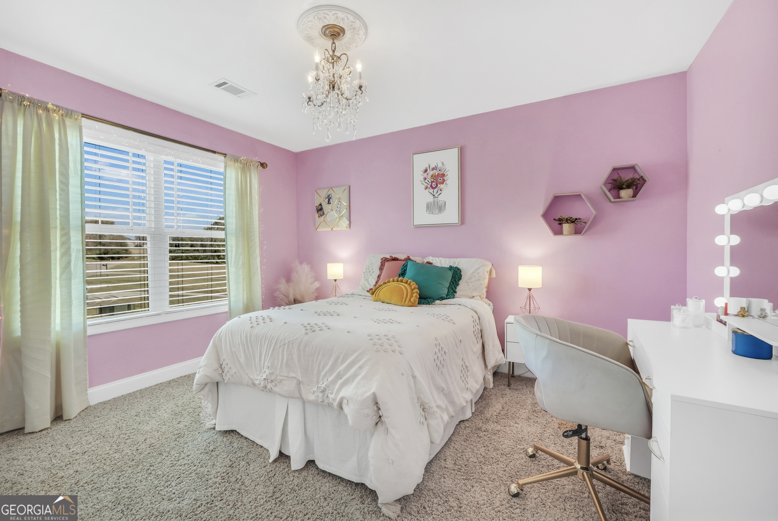 196 Magnolia Trace Milner, GA 30257 - Photo 36 of 48 a bedroom with a bed chandelier and a window