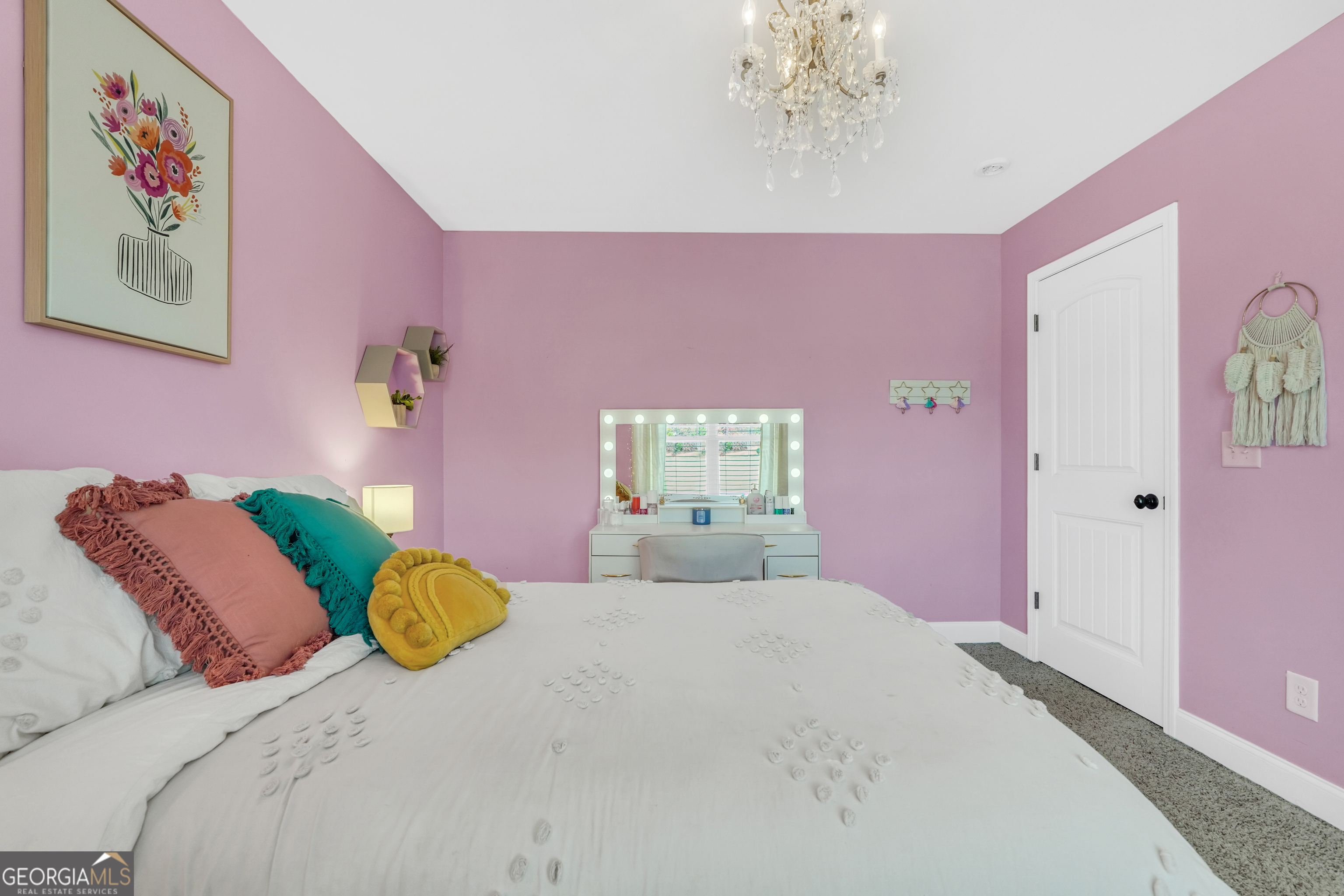 196 Magnolia Trace Milner, GA 30257 - Photo 37 of 48 a bedroom with a bed and a chandelier