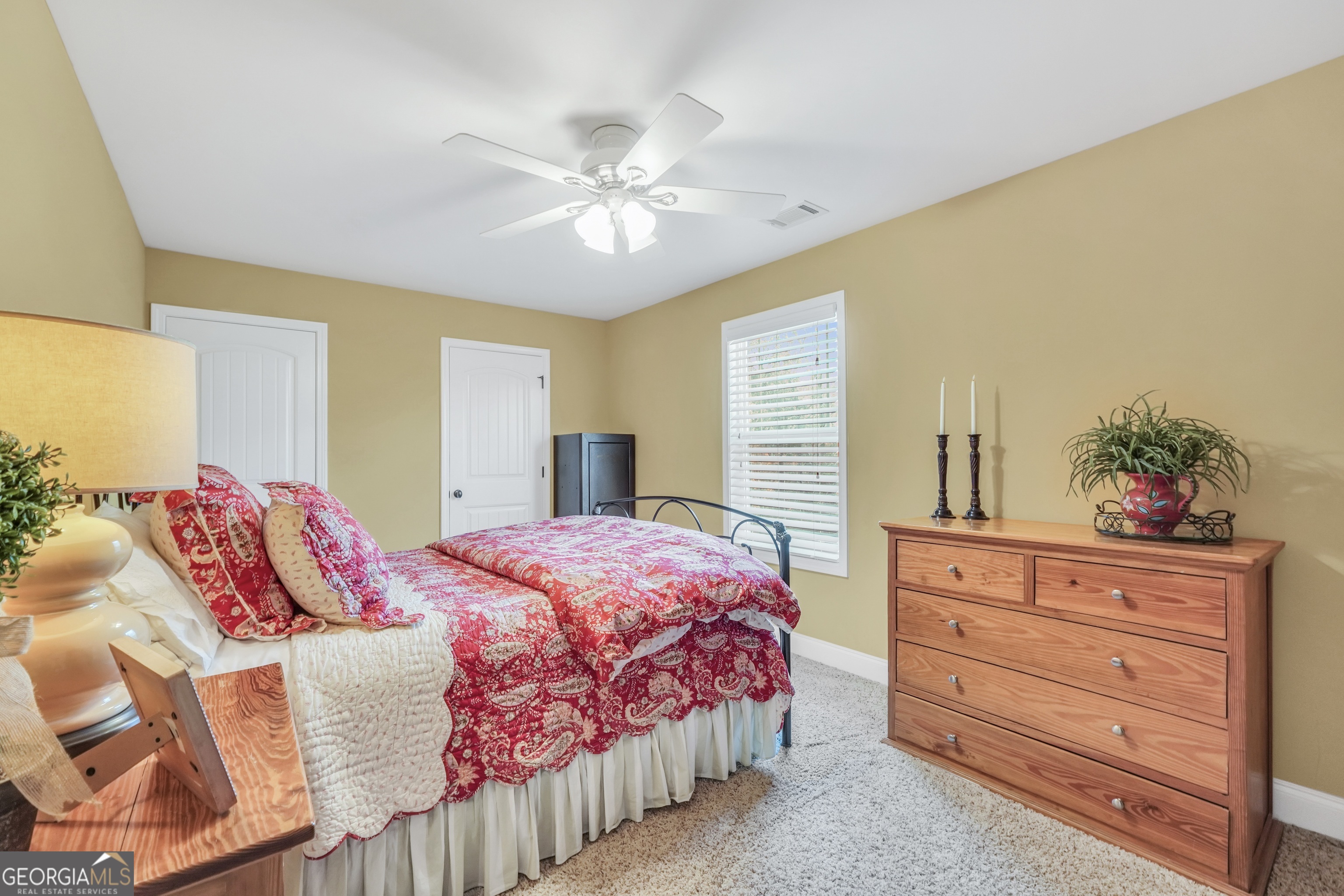 196 Magnolia Trace Milner, GA 30257 - Photo 39 of 48 a bedroom with a bed and a dresser