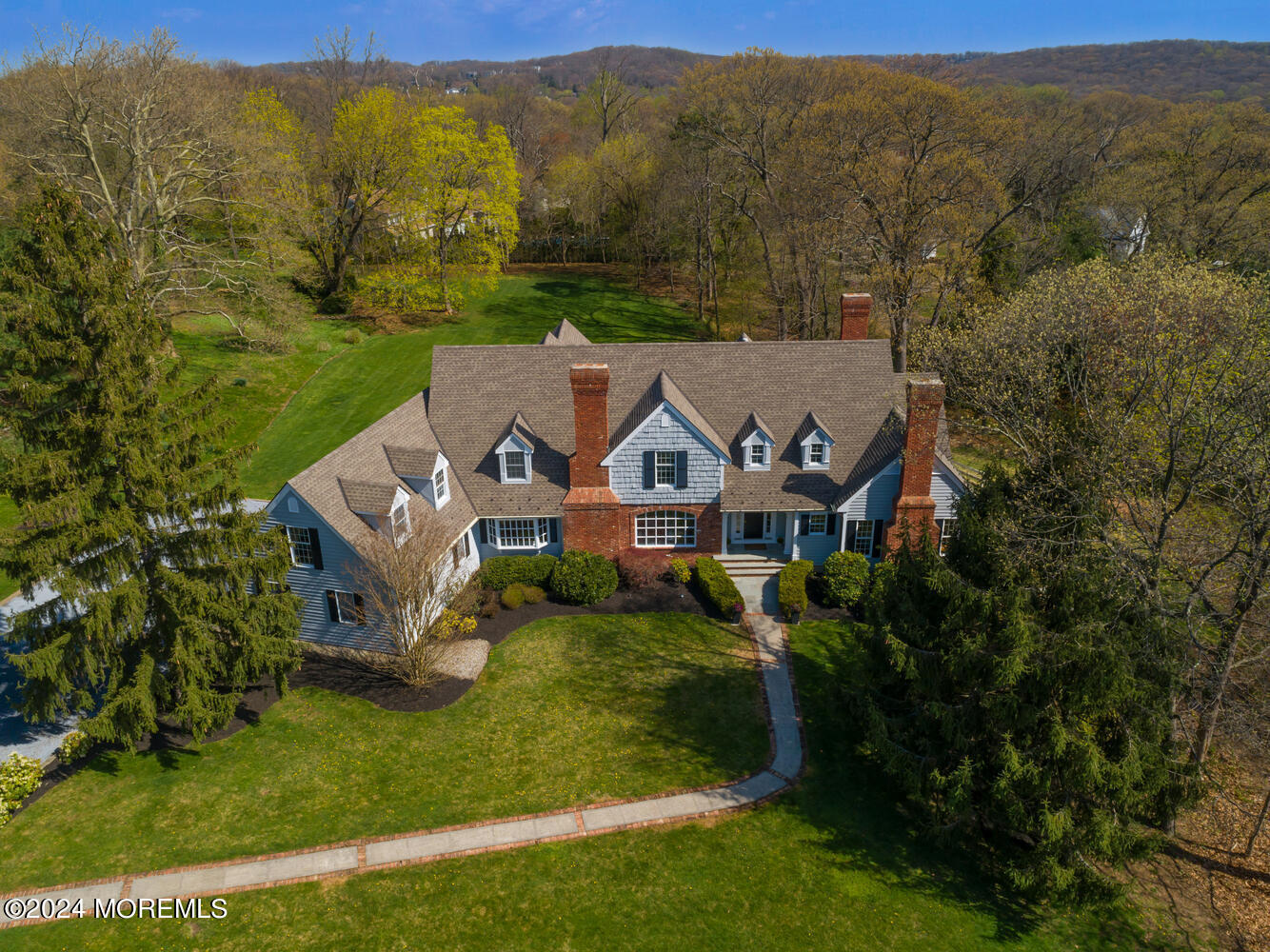 an aerial view of a house with big yard