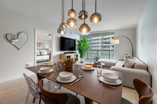 a living room with fireplace furniture and a flat screen tv
