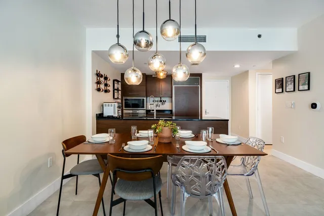 a view of a dining area with furniture and a chandelier