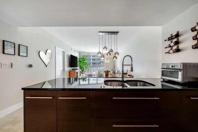 a kitchen with a sink and cabinets