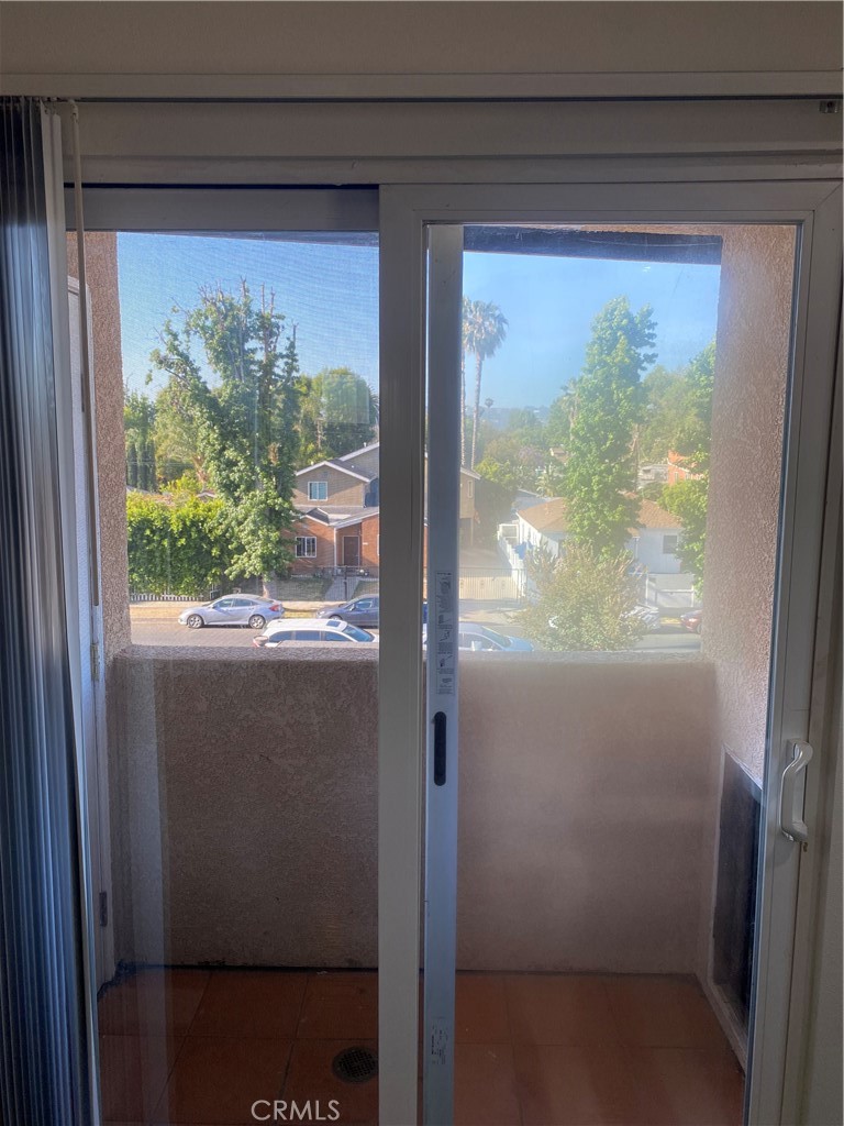 14343 Tiara Street, Unit 2 Sherman Oaks, CA 91401 - Photo 12 of 23 a view of a glass door with a large window
