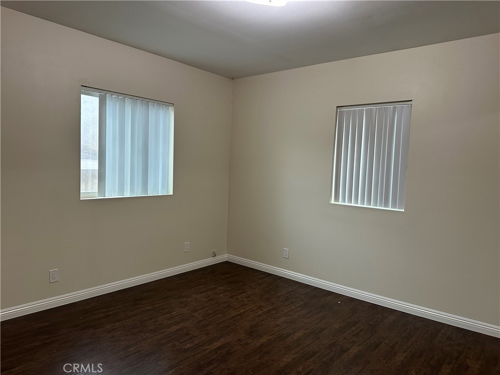 14343 Tiara Street, Unit 2 Sherman Oaks, CA 91401 - Photo 22 of 23 a view of an empty room with wooden floor and a window
