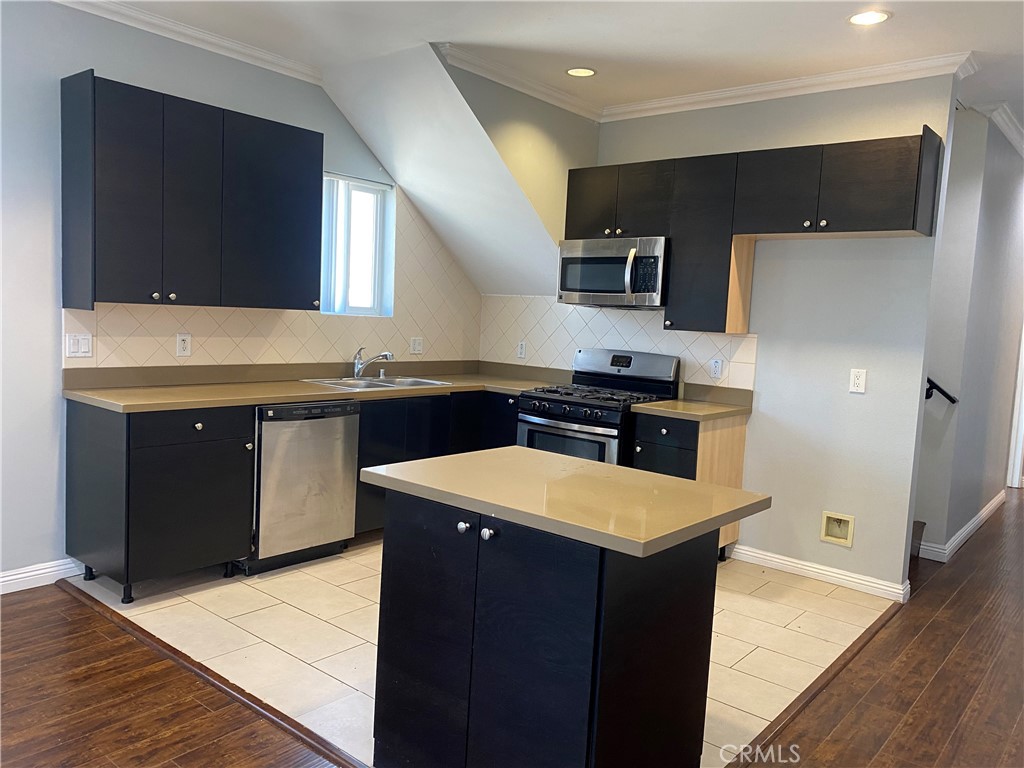 14343 Tiara Street, Unit 2 Sherman Oaks, CA 91401 - Photo 4 of 23 a kitchen with a sink and a refrigerator