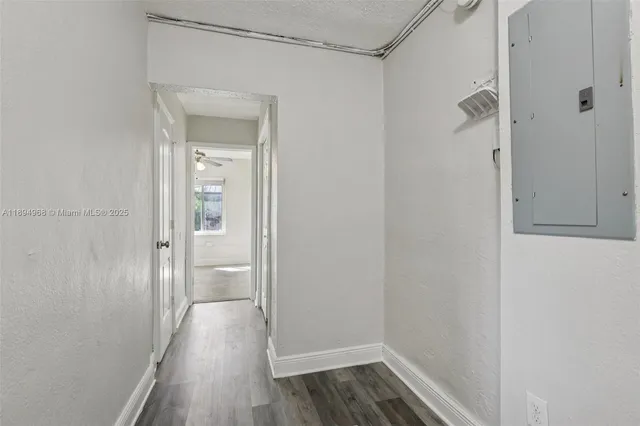 a view of a room with wooden floor