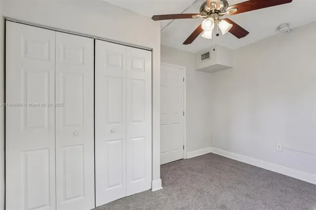 an empty room with fan