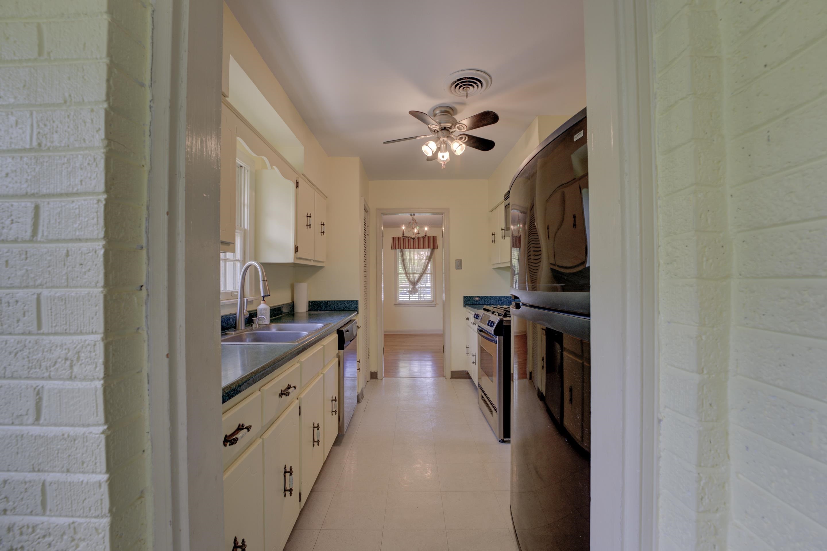 1155 Marcia Road Memphis, TN 38117 - Photo 12 of 31 a large kitchen with a lot of counter space and wooden floor
