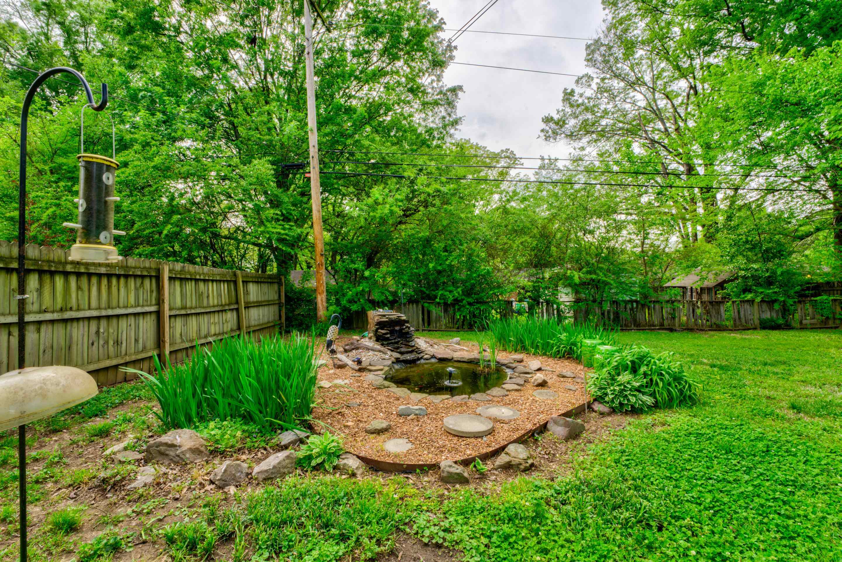 1155 Marcia Road Memphis, TN 38117 - Photo 27 of 31 a view of a backyard with plants and garden