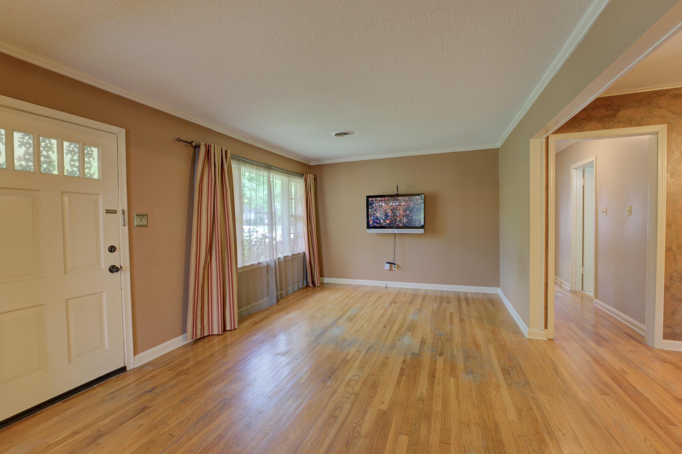 1155 Marcia Road Memphis, TN 38117 - Photo 3 of 31 a view of a big room with wooden floor and windows